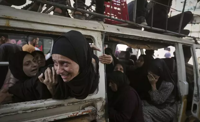 Palestinians mourn their relatives killed from an Israeli army bombardment of Gaza, at Shifa Hospital in Gaza City Tuesday, July 22, 2025. (AP Photo/Jehad Alshrafi)