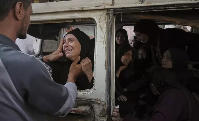 Palestinians mourn their relatives killed from an Israeli army bombardment of Gaza, at Shifa Hospital in Gaza City Tuesday, July 22, 2025. (AP Photo/Jehad Alshrafi)
