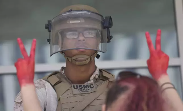 FILE - Protesters confront Marines outside the Federal Building on July 4, 2025 in Los Angeles. (AP Photo/Jill Connelly, file)