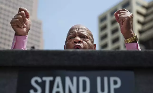 FILE - Rep. John Lewis, D-Ga., addresses a crowd at a rally protesting the National Rifle Association's annual convention a few blocks away in Atlanta, April 29, 2017. (AP Photo/David Goldman, file)