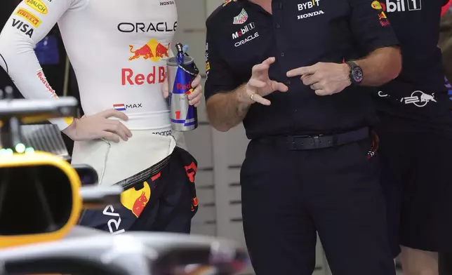 FILE - Red Bull team principal Christian Horner talks with Red Bull driver Max Verstappen of the Netherlands during qualifying session ahead of the Formula One Saudi Arabian Grand Prix at the Jeddah Corniche Circuit, in Jedda, Saudi Arabia, March 8, 2024. (AP Photo/Giuseppe Cacace, File)