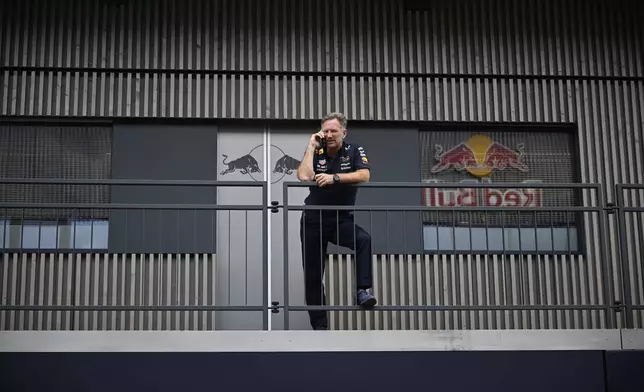 FILE - Red Bull team principal Christian Horner talks on the phone before the first free practice at the Red Bull Ring racetrack, ahead of the Austrian Formula One Grand Prix in Spielberg, Austria, June 27, 2025. (AP Photo/Denes Erdos, File)