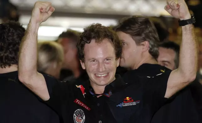 FILE - Red Bull team principal Christian Horner of Britain celebrates after Red Bull driver Sebastian Vettel of Germany became 2010 Formula One World champion and wins the Emirates Formula One Grand Prix at the Yas Marina racetrack, in Abu Dhabi, United Arab Emirates, Nov. 14, 2010. (AP Photo/Luca Bruno, File)