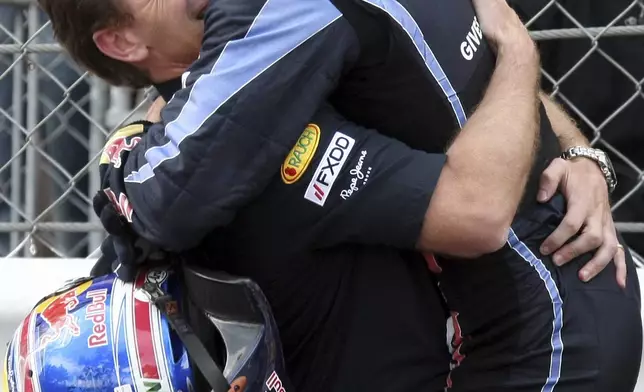 FILE - Red Bull driver Mark Webber of Australia, right, celebrates with Red Bull team principal Christian Horner of Britain after he won the Monaco Formula One Grand Prix at the Monaco racetrack, in Monaco, May 16, 2010. (AP Photo/David Vincent, File)