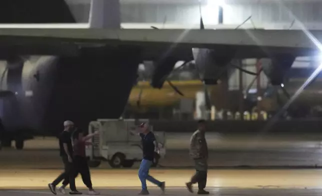 Jailed Americans that were released by Venezuela arrive in San Antonio, Friday, July 18, 2025. (AP Photo/Eric Gay)