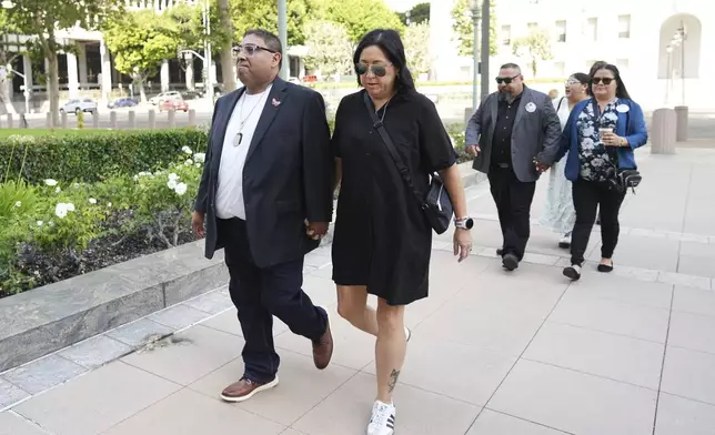 From left to right, Jerry Mata, Veronica Mata, Javier Cazares and Gloria Cazares arrive for a court hearing in a lawsuit between victims' families in the 2022 Uvalde, Texas school shooting and Meta Platforms on Friday, July 18, 2025, in Los Angeles. (AP Photo/Eric Thayer)