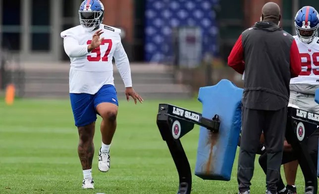 FILE - New York Giants' Dexter Lawrence II participates during an NFL football practice in East Rutherford, N.J., Wednesday, May 28, 2025. (AP Photo/Seth Wenig, File)