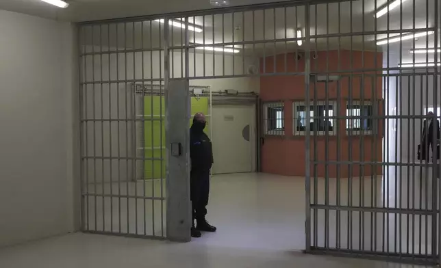 FILE - A guard stands the Vendin-le-Vieil prison, northern France, May 14, 2025. (AP Photo/Michel Euler, Pool, File)