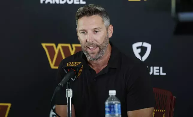 Washington Commanders general manager Adam Peters speaks during a news conference at the NFL football team's training camp in Ashburn, Va., Tuesday, July 22, 2025. (AP Photo/Luis M. Alvarez)