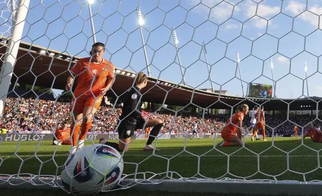 Netherlands players react after England's Lauren James, on the video screen, scored her side's third goal during the Euro 2025, group D, soccer match between England and the Netherlands at Stadion Letzigrund in Zurich, Switzerland, Wednesday, July 9, 2025. (AP Photo/Alessandra Tarantino)