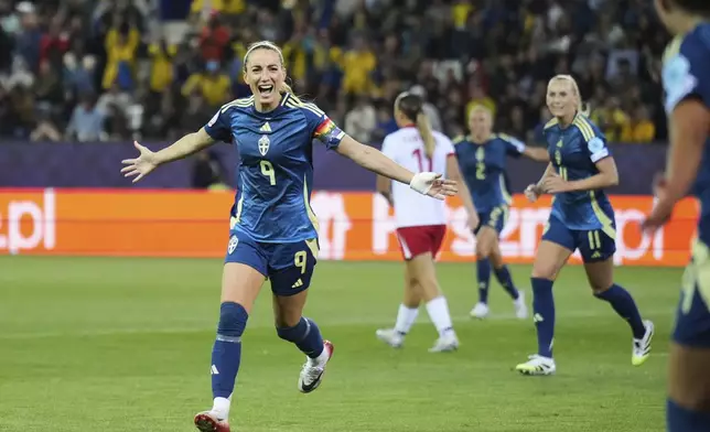 Sweden's Kosovare Asllani celebrates after scoring her side's second goal during the Euro 2025, group C, soccer match between Poland and Sweden at Allmend Stadion Luzern in Lucerne, Switzerland, Tuesday, July 8, 2025. (AP Photo/Alessandra Tarantino)