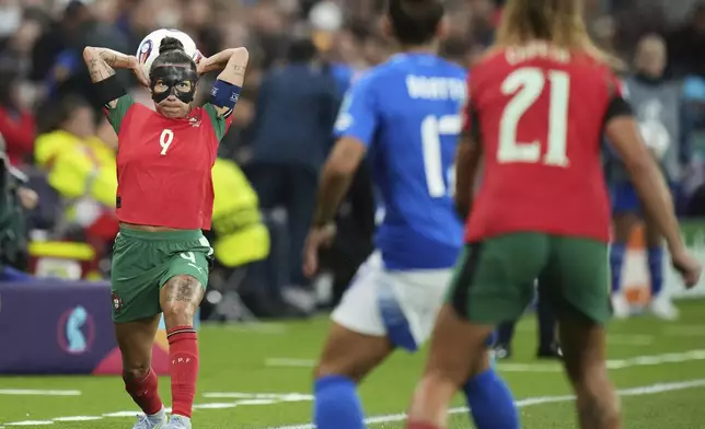 Portugal's Ana Borges throws the ball during the Euro 2025, group B, soccer match between Portugal and Italy at Stade de Geneve in Geneva, Switzerland, Monday, July 7, 2025. (AP Photo/Alessandra Tarantino)