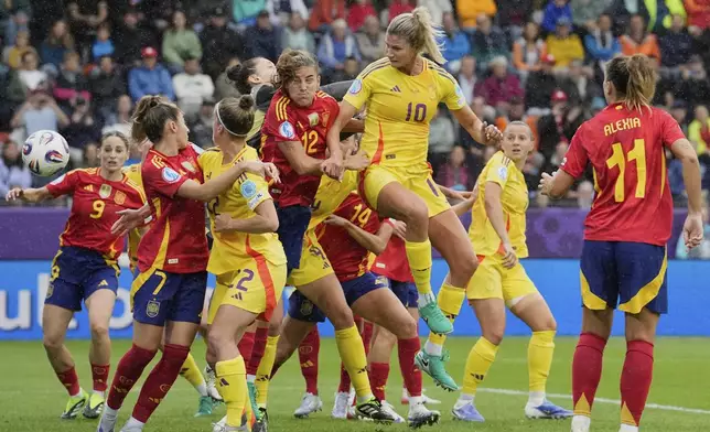 Belgium's Justine Vanhaevermaet (10) scores the opening goal during the Euro 2025, group B, soccer match between Spain and Belgium at Arena Thun in Thun, Switzerland, Monday, July 7, 2025. (AP Photo/Martin Meissner)