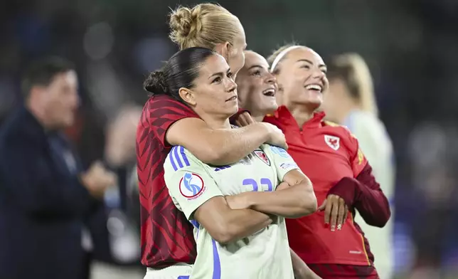 Wales's Alys Morgan Ffion, left, and her teammates react to their supporters at the end of the Euro 2025, group D, soccer match between France and Wales at Arena St. Gallen in St. Gallen, Switzerland, Wednesday, July 9, 2025. (Gian Ehrenzeller/Keystone via AP)