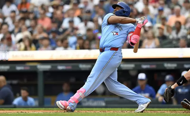 Toronto Blue Jays' Vladimir Guerrero Jr. singles off Detroit Tigers starting pitcher Tarik Skubal during the fourth inning of a baseball game, Saturday, July 26, 2025, in Detroit. (AP Photo/Jose Juarez)