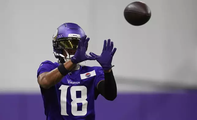 Minnesota Vikings wide receiver Justin Jefferson (18) takes part in drills during the team's NFL football training camp Wednesday, July 23, 2025, in Eagan, Minn. (AP Photo/Abbie Parr)