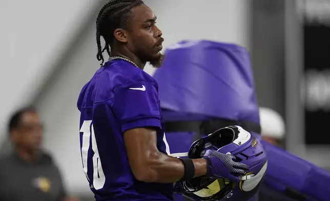 Minnesota Vikings wide receiver Justin Jefferson (18) stands on the field during the team's NFL football training camp Wednesday, July 23, 2025, in Eagan, Minn. (AP Photo/Abbie Parr)