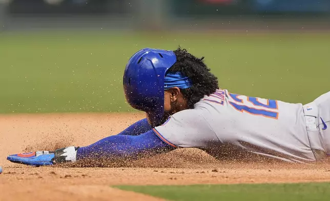 New York Mets' Francisco Lindor steals second during the fourth inning of a baseball game against the Kansas City Royals, Saturday, July 12, 2025, in Kansas City, Mo. (AP Photo/Charlie Riedel)