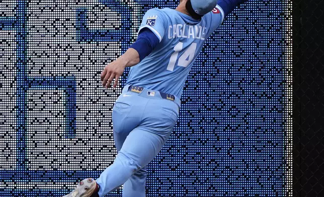 Kansas City Royals right fielder Jac Caglianone can't catch a fly ball double hit by New York Mets' Pete Alonso during the ninth inning of a baseball game Saturday, July 12, 2025, in Kansas City, Mo. (AP Photo/Charlie Riedel)