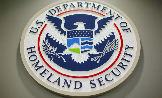 FILE - The Department of Homeland Security logo is seen during a news conference in Washington, Feb. 25, 2015. (AP Photo/Pablo Martinez Monsivais, File)