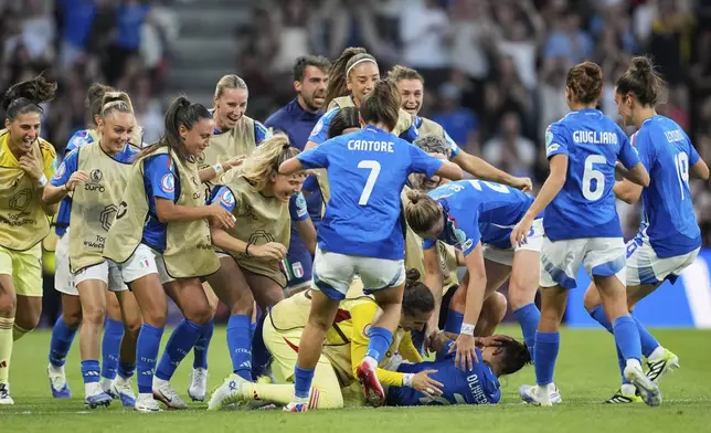 Italy's Elisabetta Oliviero, on the ground, celebrates after scoring the opening goal during the Women's Euro 2025, group B, soccer match between Italy and Spain at Stadion Wankdorf in Bern, Switzerland, Friday, July 11, 2025. (AP Photo/Martin Meissner)