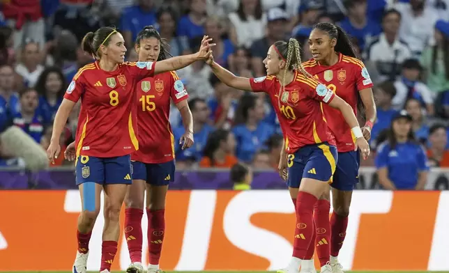 Spain's Athenea celebrates with Mariona Caldentey, left, after scoring her side's first goal during the Women's Euro 2025, group B, soccer match between Italy and Spain at Stadion Wankdorf in Bern, Switzerland, Friday, July 11, 2025. (AP Photo/Martin Meissner)