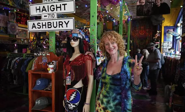 Sunshine Powers, owner of Love on Haight and fan of the Grateful Dead, poses for a photograph inside her store Saturday, July 19, 2025, in San Francisco. (AP Photo/Godofredo A. Vasquez)
