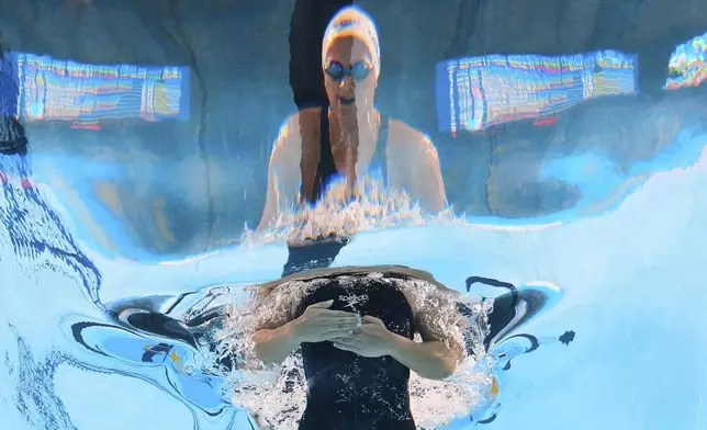 Palestinian swimmer Marina Abu Shamaleh competes in the women's 100-meter breaststroke heat at the World Aquatics Championships in Singapore, Monday, July 28, 2025. (AP Photo/Lee Jin-man)
