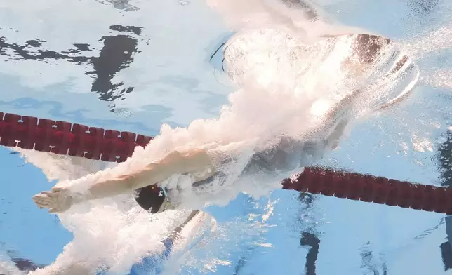 Yu Zidi of China competes in the women's 200-meter individual medley heat at the World Aquatics Championships in Singapore, Sunday, July 27, 2025. (AP Photo/Lee Jin-man)