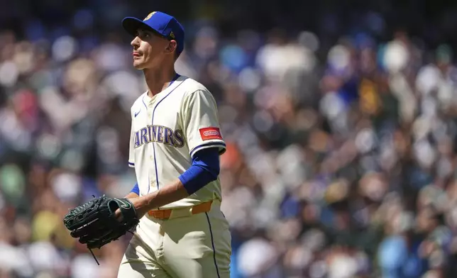 Seattle Mariners starting pitcher George Kirby returns to the dugout after being relieved against the Pittsburgh Pirates during the seventh inning of a baseball game Sunday, July 6, 2025, in Seattle. (AP Photo/Lindsey Wasson)