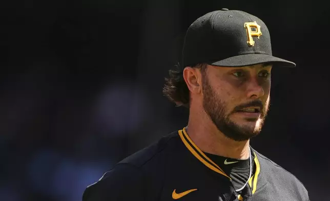 Pittsburgh Pirates starting pitcher Paul Skenes walks back to the dugout after retiring the side against the Seattle Mariners during the fifth inning of a baseball game Sunday, July 6, 2025, in Seattle. (AP Photo/Lindsey Wasson)