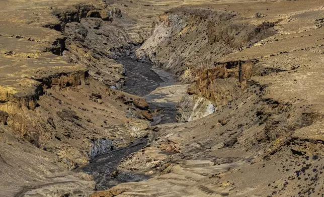 A dried up river bed is seen on the way to the abandoned Samjung village in the Mustang region, 462 kilometers (288 miles) west of Kathmandu, Nepal, Friday, April 18, 2025. (AP Photo/Niranjan Shrestha)