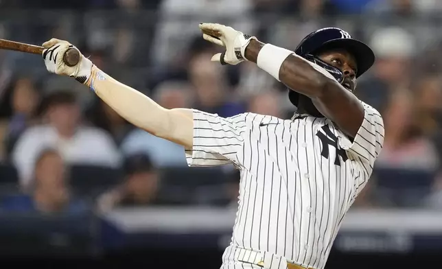 New York Yankees' Jazz Chisholm Jr. (13) hits home run during the fifth inning of a baseball game against the Seattle Mariners, Wednesday, July 9, 2025, in New York. (AP Photo/Yuki Iwamura)