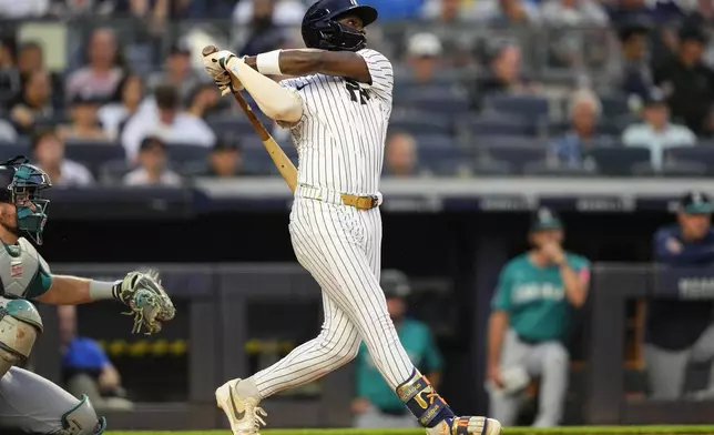 New York Yankees' Jazz Chisholm Jr. hits a home run during the third inning of a baseball game against the Seattle Mariners, Wednesday, July 9, 2025, in New York. (AP Photo/Yuki Iwamura)