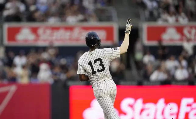 New York Yankees' Jazz Chisholm Jr. (13) runs the bases after hitting a home run during the third inning of a baseball game against the Seattle Mariners, Wednesday, July 9, 2025, in New York. (AP Photo/Yuki Iwamura)