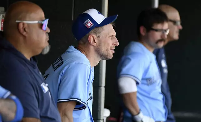 Toronto Blue Jays starting pitcher Max Scherzer watches from the dugout in the sixth inning of a baseball game against the Detroit Tigers, Sunday, July 27, 2025, in Detroit. (AP Photo/Jose Juarez)