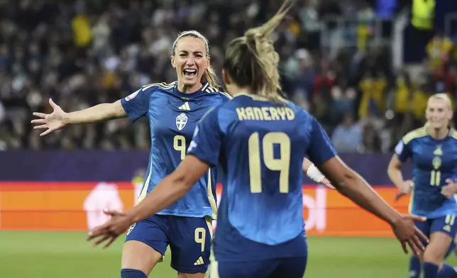 Sweden's Kosovare Asllani celebrates after scoring her side's second goal during the Euro 2025, group C, soccer match between Poland and Sweden at Allmend Stadion Luzern in Lucerne, Switzerland, Tuesday, July 8, 2025. (AP Photo/Alessandra Tarantino)