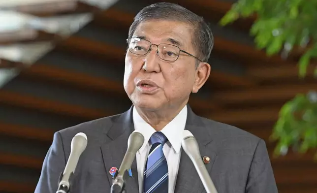 Japan's Prime Minister Shigeru Ishiba speaks to the media at his office in Tokyo Wednesday, July 30, 2025, after a powerful earthquake in Russia's Far East prompted tsunami warnings in parts of Japan. (Mizuki Ikari/Kyodo News via AP)