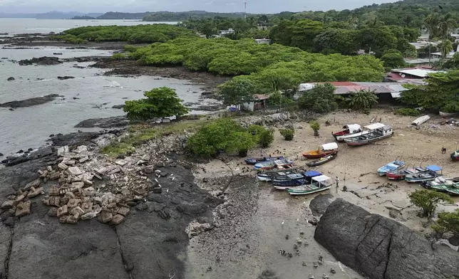Boats sit on the shore in Veracruz, Panama, Wednesday, July 30, 2025, after fishermen removed them from the water as a precaution following a tsunami warning after an earthquake struck off the coast of Russia. (AP Photo/Matias Delacroix)