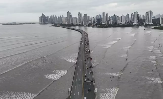 Cars are at a standstill along the Pan-American Highway in Panama City, Wednesday, July 30, 2025, following a tsunami warning after a earthquake struck off the coast of Russia early Wednesday. (AP Photo/Matias Delacroix)