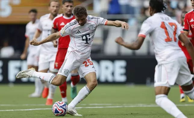 Bayern Munich's Thomas Muller shoots during the Club World Cup Group C soccer match between Benfica and Bayern Munich in Charlotte, N.C., Tuesday, June 24, 2025. (AP Photo/Nell Redmond)