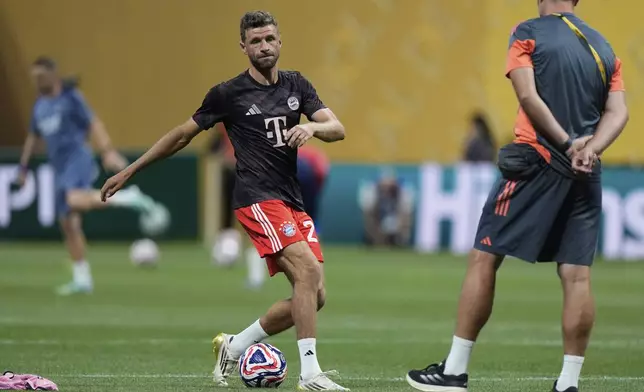 Bayern Munich's Thomas Muller warms up before the Club World Cup quarterfinal soccer match between PSG and Bayern Munich in Atlanta, Saturday, July 5, 2025. (AP Photo/Mike Stewart)