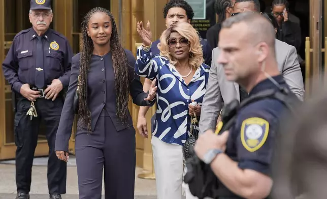 Janice Combs, right, mother of Sean "Diddy" Combs, reacts outside Manhattan federal court after Combs' was convicted of a prostitution-related offense but acquitted on the most serious charges at his New York trial, Wednesday, July 2, 2025, in New York. (AP Photo/Yuki Iwamura)