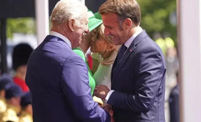 Britain's King Charles III and Queen Camilla welcome French President Emmanuel Macron and his wife Brigitte to Windsor Castle in Windsor, England, Tuesday, July 8, 2025.(AP Photo/Alberto Pezzali, Pool)