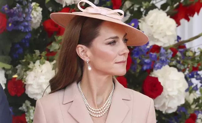 Britain's Kate, Princess of Wales awaits the arrival of France's President Emmanuel Macron and his wife Brigitte Macron in Windsor, England, Tuesday July 8, 2025, on the first day of a three-day state visit to Britain. (Chris Jackson/Pool via AP)