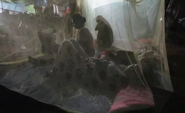 Cambodians take refuge at the Batploa primary school in the Oddar Meanchey province, Cambodia, Thursday, July 24, 2025, as Thai and Cambodian soldiers clashed in several areas along their border in a major escalation of their conflict that left at least several people dead, mostly civilians. (AP Photo/Heng Sinith)