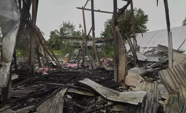 A house is seen damaged after Cambodia fired artillery shells in Surin Province, Thailand, Sunday, July 27, 2025. (AP Photo/Sakchai Lalit)