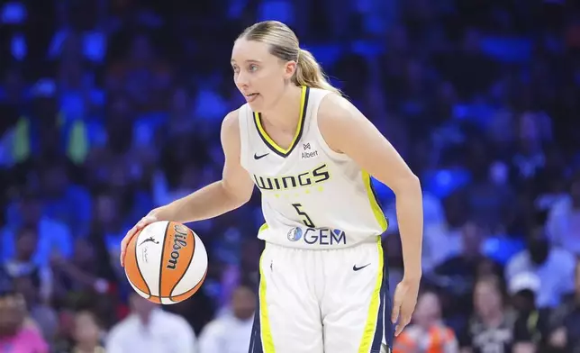 Dallas Wings guard Paige Bueckers dribbles during the second half of a WNBA basketball game against the Dallas Wings in Arlington, Texas, Monday, July 28, 2025. (AP Photo/LM Otero)