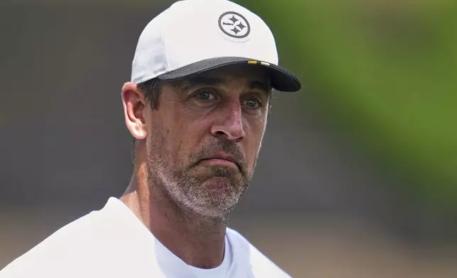 Pittsburgh Steelers quarterback Aaron Rodgers grimaces during practice at the team’s NFL football training camp in Latrobe, Pa., Thursday, July 24, 2025. (AP Photo/Gene J. Puskar)