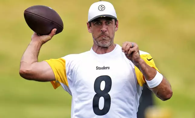 Pittsburgh Steelers quarterback Aaron Rodgers throws a pass during practice at the team’s NFL football training camp, in Latrobe, Pa., Thursday, July 24, 2025. (AP Photo/Gene J. Puskar)
